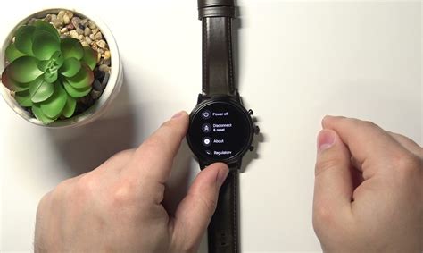 fossil smartwatch reset button.